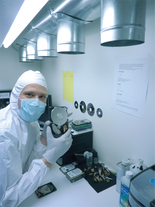 ADR technician performing controlled cleanroom recovery work
